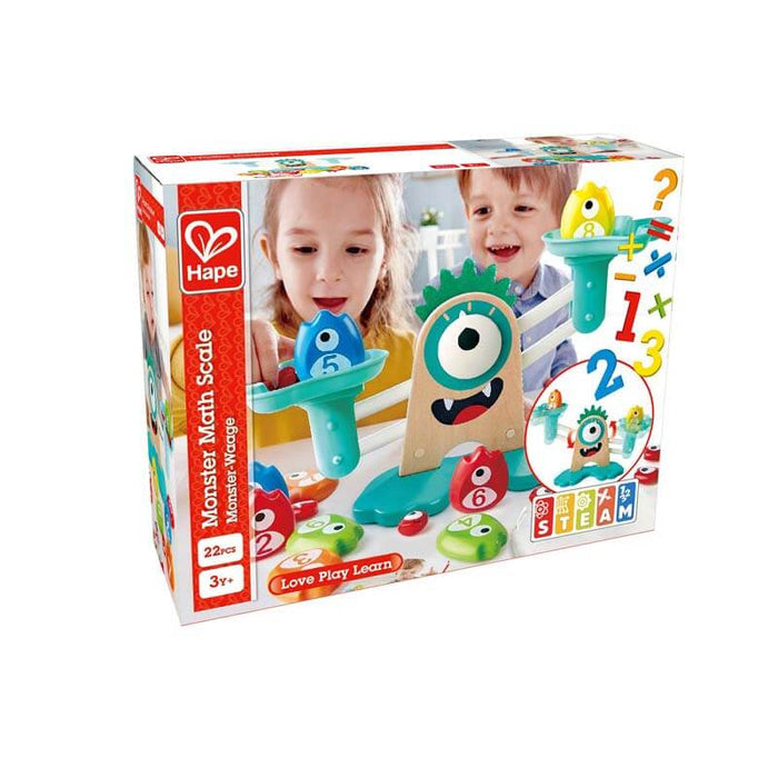 Toy box for a wooden monster balance scale with blue pans, colorful numbered weights, and two kids playing.
