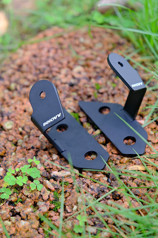 INNOVV Kawasaki Ninja 400 motorcycle camera brackets laid out on grass ground