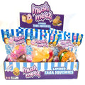 Retail display of food-themed Mush Meez Layered Taba Squishies in colorful blue and white striped packaging.