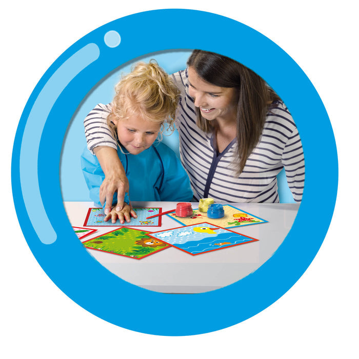 Woman helping a child finger paint on illustrated square cards with pots of red, yellow, and blue paint.