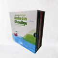 White box set with a red boat and green hill illustration, holding three books with colorful spines.