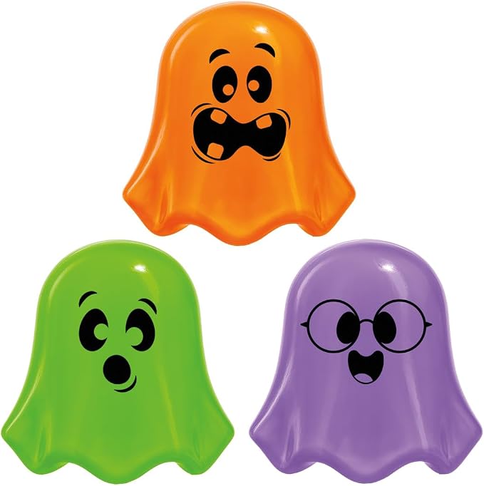 Three ghost-shaped squishy toys in orange, green, and purple, each with a unique silly or surprised facial expression.