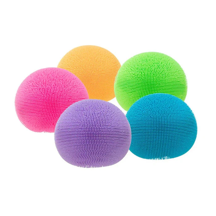 Five colorful squishy balls with soft fuzzy bristles in pink, orange, lime green, purple, and blue.