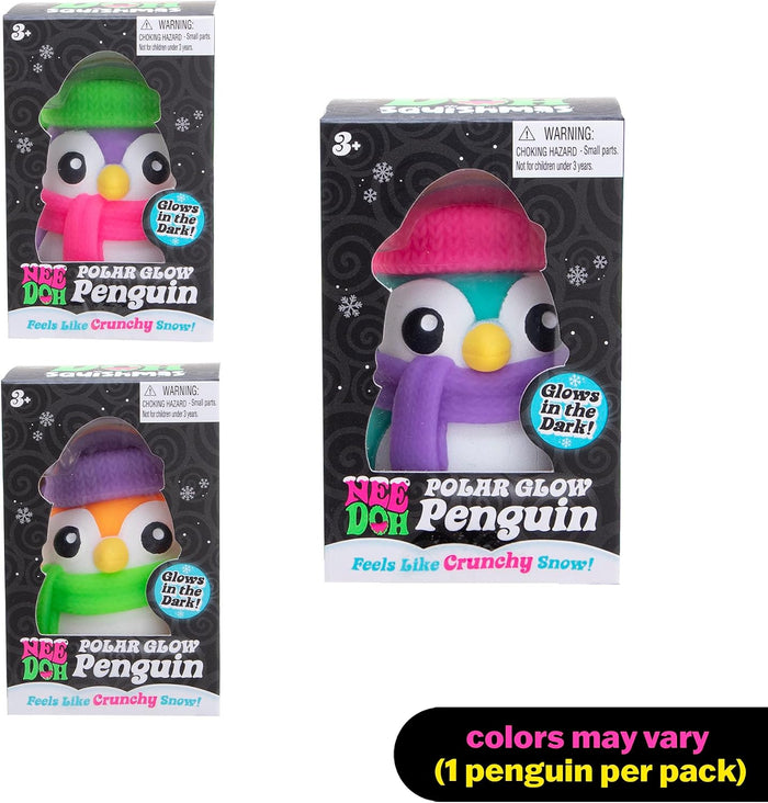 Three boxed colorful penguin squish toys with knit hats. Text says they glow in the dark and feel like crunchy snow.