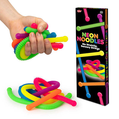 Six vibrant, textured stretchy strings in neon colors shown in a hand, a pile, and their black retail box.