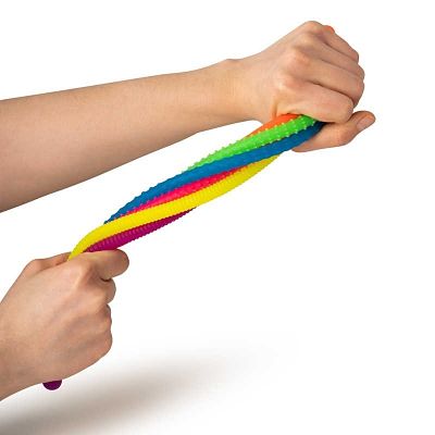 Hands stretching and twisting a bundle of colorful, bumpy, neon-colored stretchy strings.