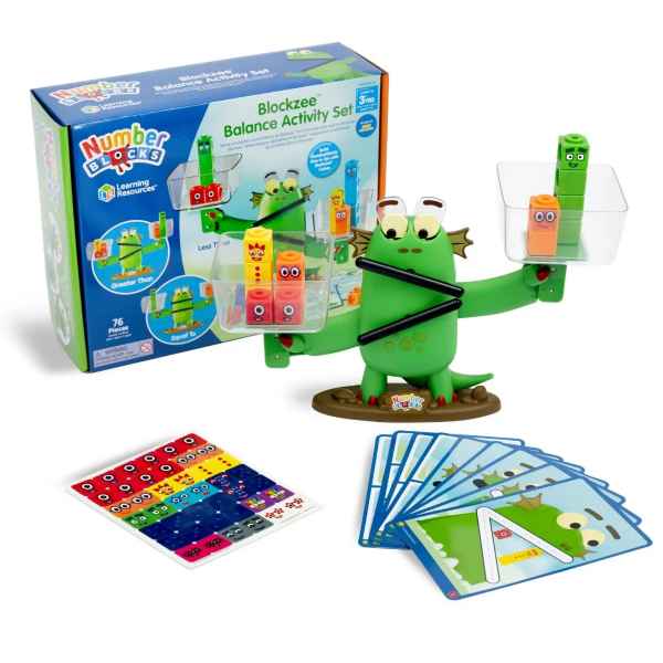 Green monster balance scale with colorful blocks in trays, pictured with activity cards and product packaging.