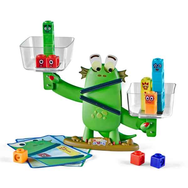 Green monster balance scale holding clear buckets with colorful number blocks, tilted right with activity cards.