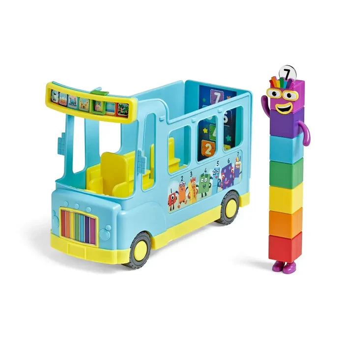 Light blue toy bus with rainbow grill next to a purple character made of seven colorful stacked blocks.