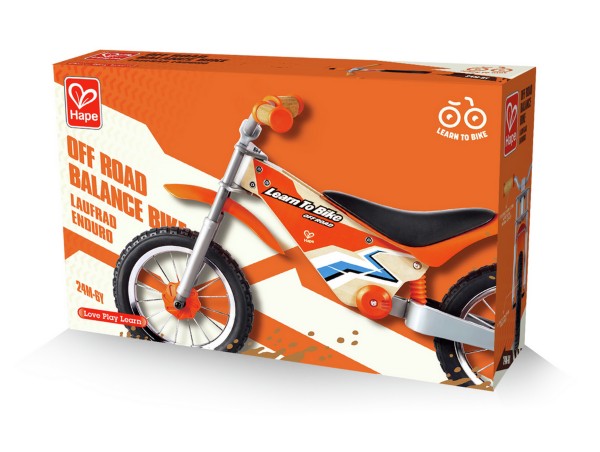 Orange Hape box for a wooden off-road balance bike with thick tires, an orange frame, black seat, and blue accents.