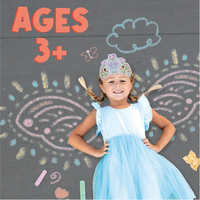 Girl in a blue dress with colorful chalk-drawn fairy wings and butterflies on a sidewalk. Large orange AGES 3+ text.