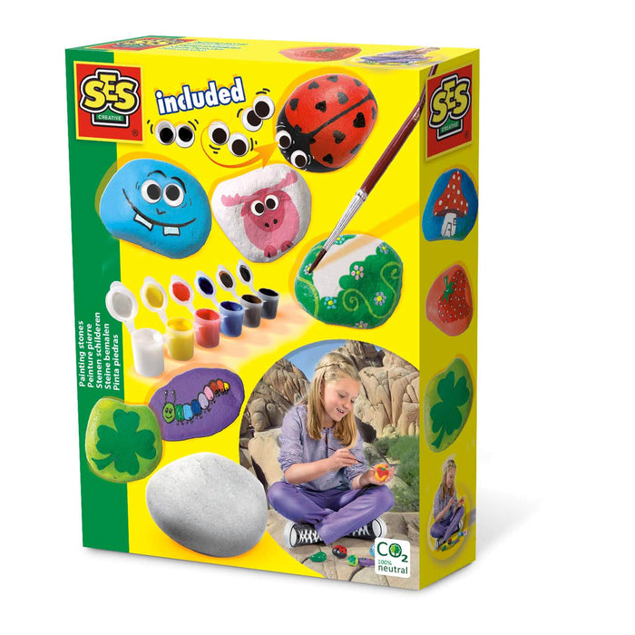 Yellow kit box featuring colorful painted rocks, small paint pots, a brush, and a child painting stones.