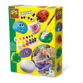Yellow kit box featuring colorful painted rocks, small paint pots, a brush, and a child painting stones.