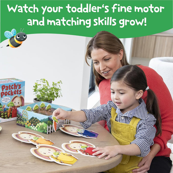 Mother and child play Patch's Pockets, matching colorful paper carrots to pockets on cardboard bunny cutouts.