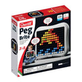 Quercetti Peg Brite box showing a white light-up pegboard with a colorful dolphin mosaic and a child playing.