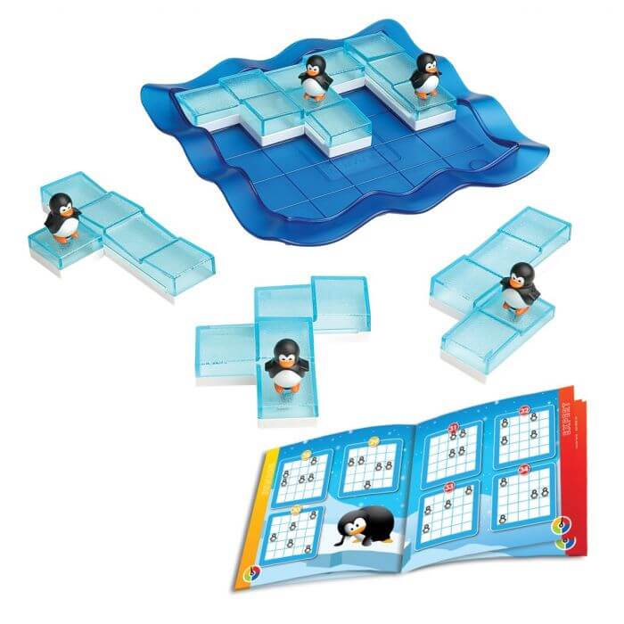 Wavy blue game board with transparent ice block puzzle pieces, small penguin figures, and a challenge booklet.