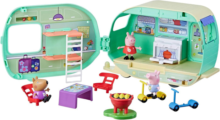 Open mint green caravan playset with 3 figures, bunk beds, kitchen, table, grill, and colorful scooters.