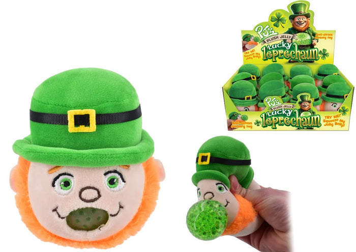 Green leprechaun plush head with orange beard. Hand squeezes it to pop a green jelly ball from its mouth.