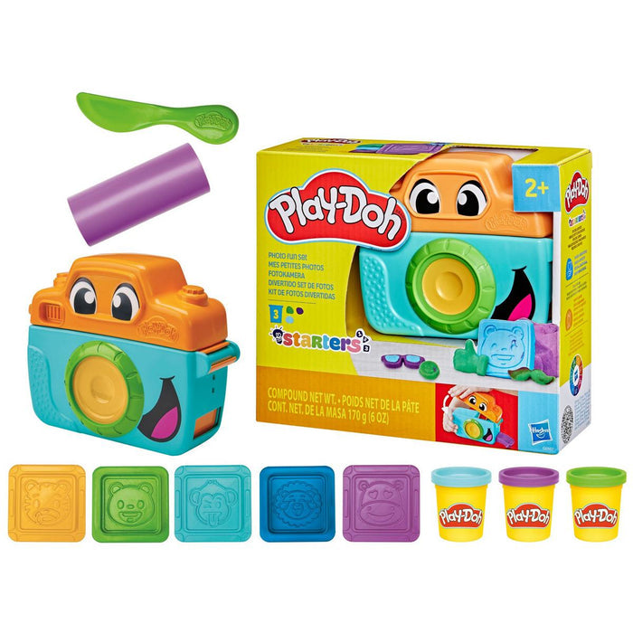 Orange and teal toy camera playset with five animal stamps, sculpting tools, and three mini Play-Doh cans.