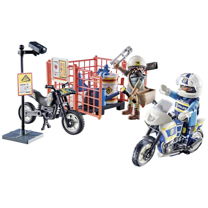 Police officer on white motorcycle, bearded thief near a red cage, black dirt bike, and security camera pole.