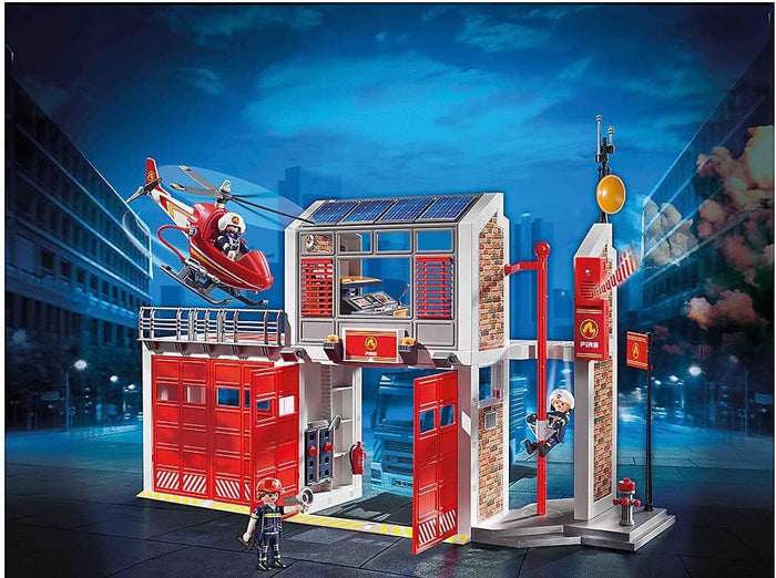 Red and white toy fire station with helipad, helicopter, sliding pole, and firefighters in a night city scene.