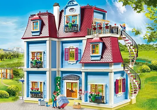 Large blue 3-story toy Victorian house with red shingled roofs, white trim, a spiral staircase, and flower window boxes.