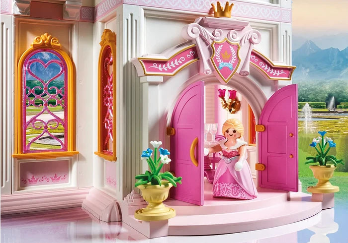 Princess figure in a pink dress at the open pink doors of a white toy castle with ornate heart-shaped windows.