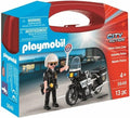 Red toy carry case featuring a Playmobil police officer with a white helmet and stop sign next to a black motorcycle.