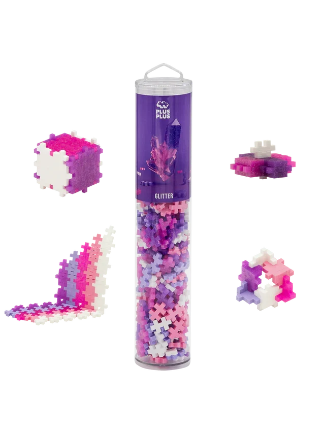 Tube of glittery pink, purple, and white plus-shaped bricks with four sample builds including a cube.