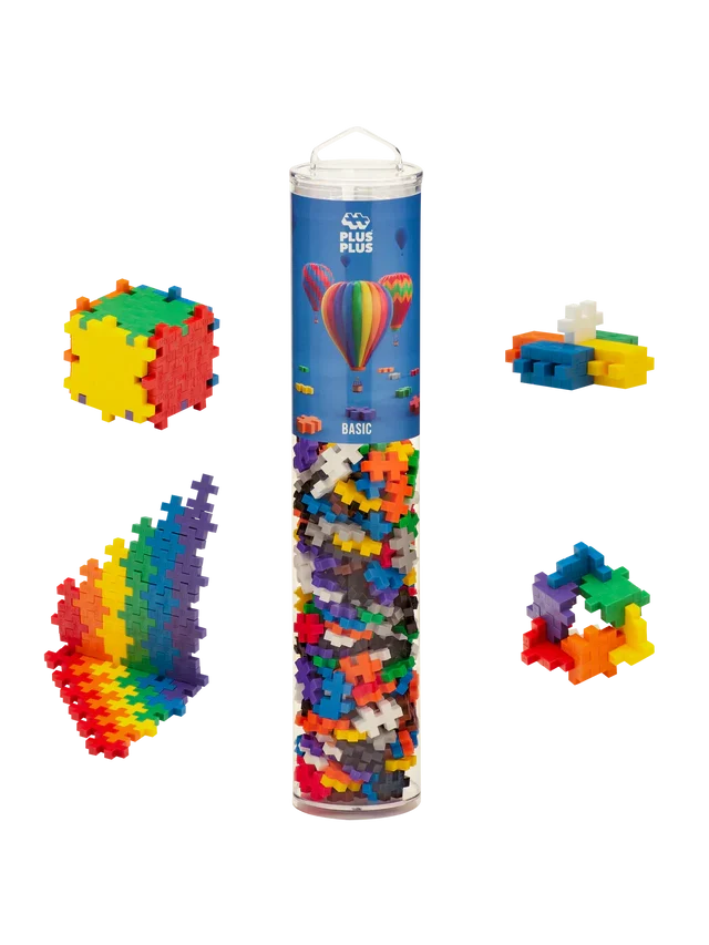Clear tube of colorful plus-shaped interlocking blocks with four sample 3D and flat builds in rainbow colors.