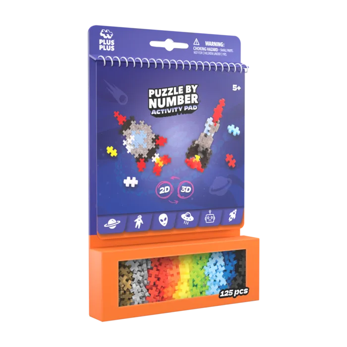 Plus Plus Space activity pad with rocket designs and 125 colorful plus-shaped pieces in an orange display box.