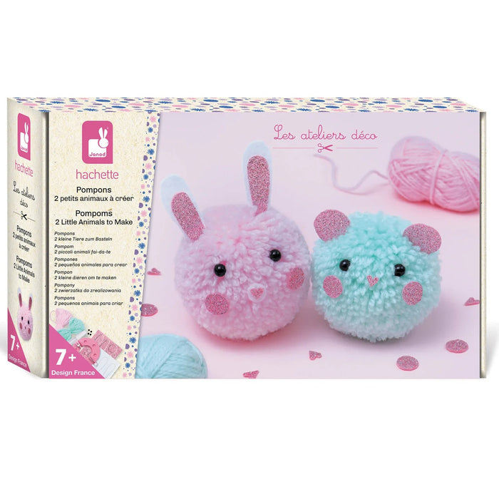 Boxed craft kit showing a fuzzy pink pom-pom bunny and mint green mouse with glittery details and yarn.