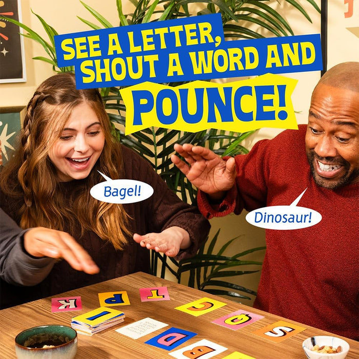 Two people reach for colorful square letter cards while shouting Bagel and Dinosaur in a fast-paced game.