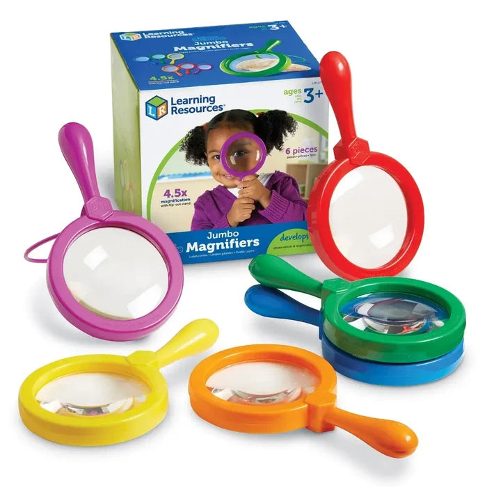 Six colorful jumbo magnifying glasses in red, orange, yellow, green, blue, and purple arranged with their storage box.