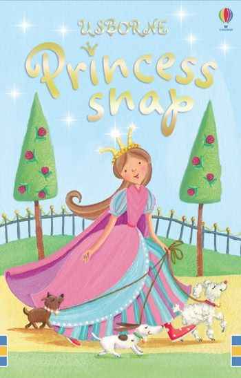 A princess in a pink dress walks three dogs in a garden on a sparkly light blue Usborne card game box cover.
