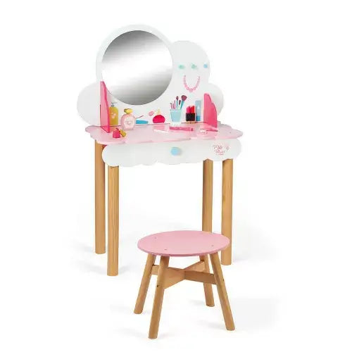 White cloud-shaped wooden vanity with round mirror, pink accents, and a matching pink-topped wooden stool.