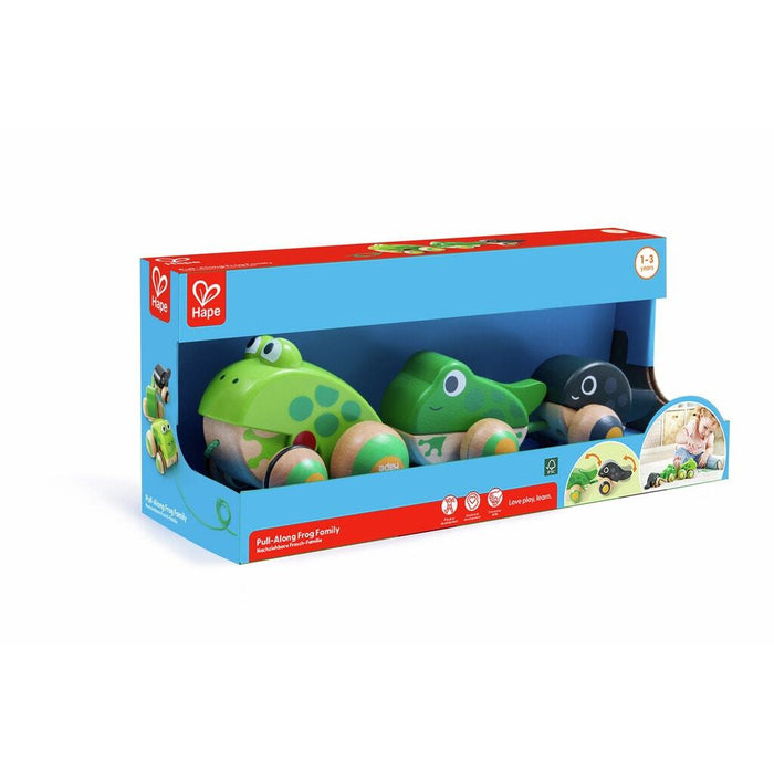 Hape Pull-Along Frog Family toy in blue box showing three wooden frogs on wheels with a pull string.