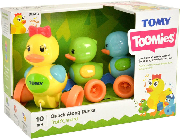Boxed toy featuring three connected yellow, green, and blue plastic ducks with orange wheels and a pull string.