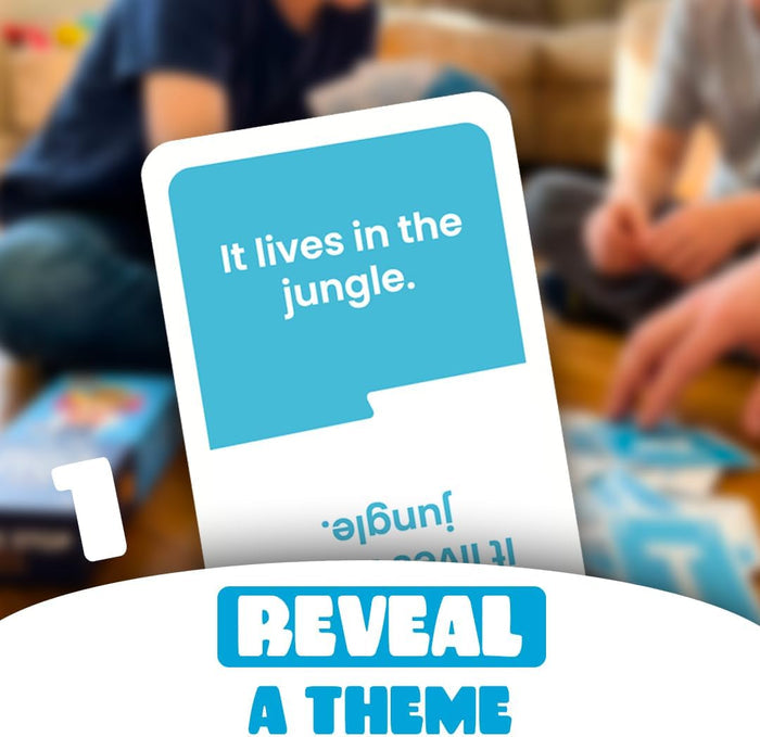 A blue game card reading "It lives in the jungle" held in front of children playing with a "Reveal a theme" banner.