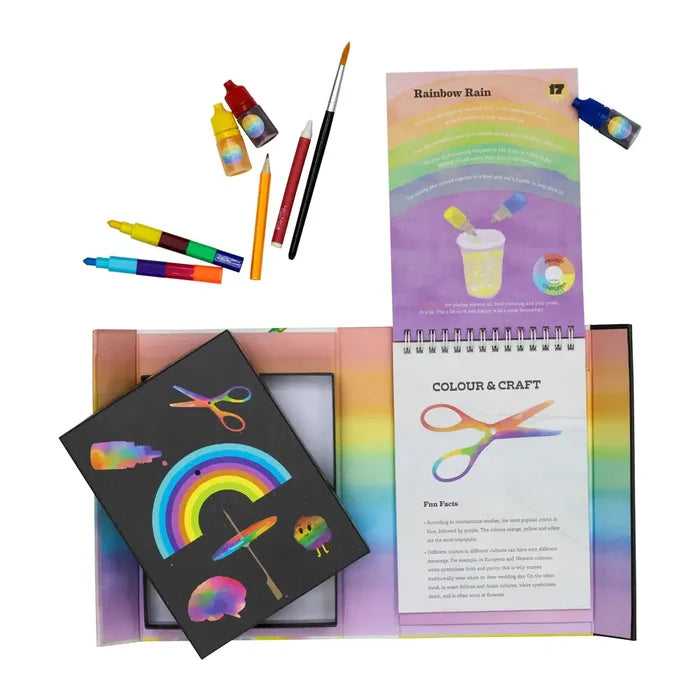 Art kit with liquid color droppers, pens, and a spiral activity book featuring rainbow-themed crafts and experiments.