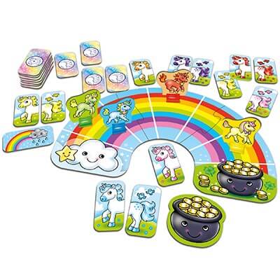 Rainbow-shaped board game with colorful unicorn playing pieces, cards, and a smiling pot of gold.