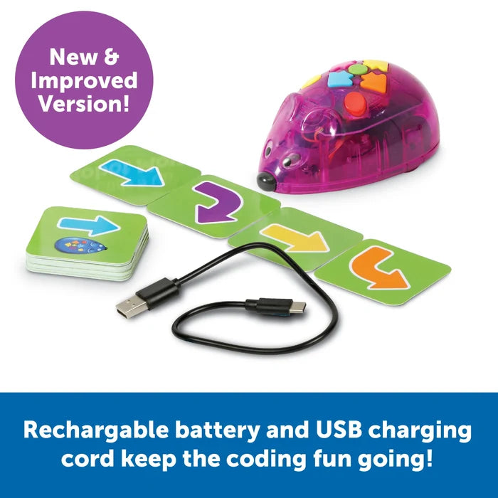 Translucent purple toy mouse with colorful buttons, green arrow coding cards, and a black USB charging cable.