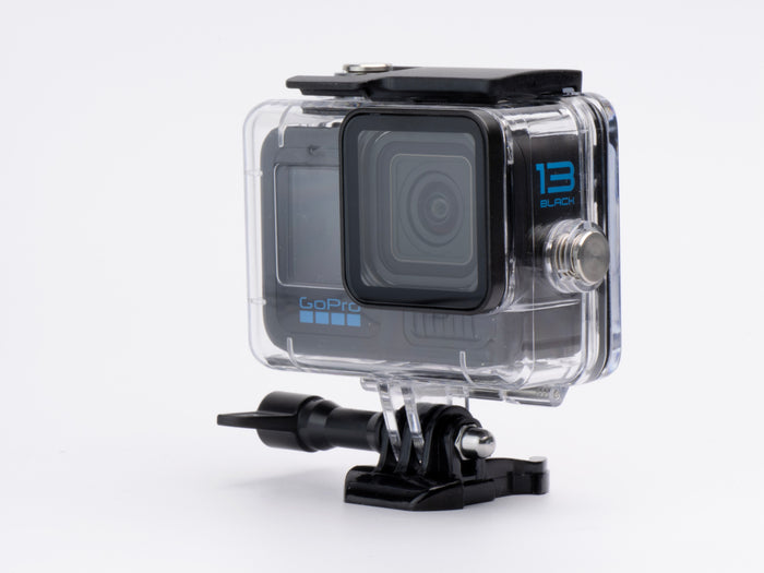 Action camera with clear protective case on a white background