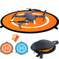 Foldable orange drone landing pad in use with quadcopter drone, includes accessories like stakes and carry pouch