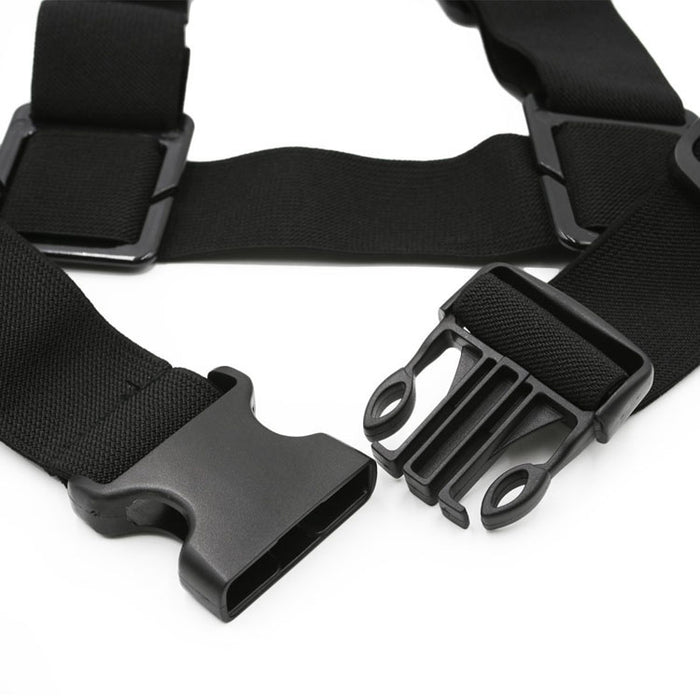 Close-up of a black adjustable shoulder strap harness with a quick-release plastic buckle clip, designed for secure and easy fastening.