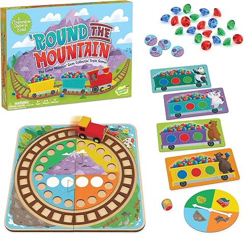 Colorful train game with circular mountain track, red toy engine, plastic gems, animal cards, and spinner.