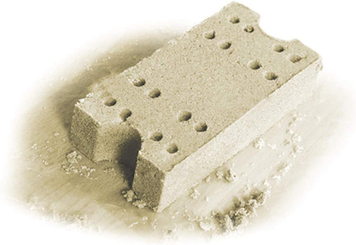 Rectangular tan sand mold with semi-circular cutouts on the ends and rows of small circular holes on the top surface.