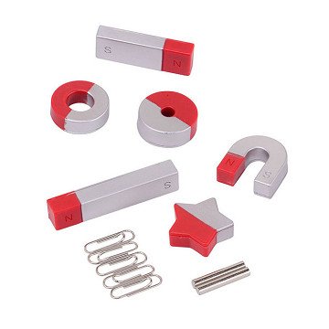 Red and silver bar, horseshoe, ring, and star magnets with paperclips and metal pins on a white background.