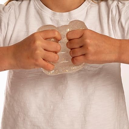 Hands squeezing clear, translucent jelly slime with shimmering glitter.