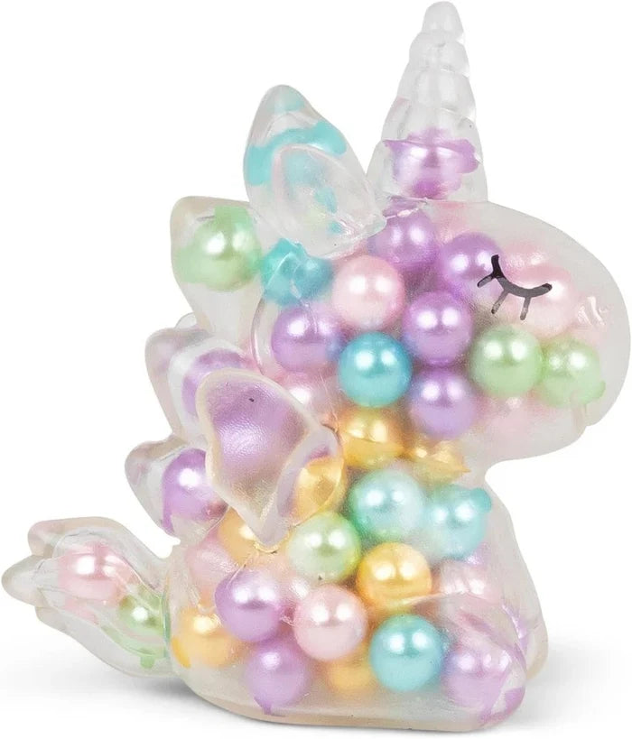 Translucent squishy unicorn toy filled with colorful iridescent beads in pink, purple, teal, green, and gold.